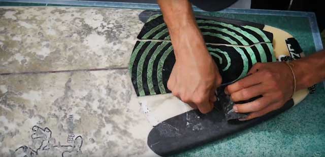Surfboard traction pad removal